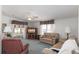 Comfortable living room featuring a ceiling fan, carpeting, and access to an enclosed lanai at 519 Tivoli Park Dr, Davenport, FL 33897