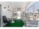 Sunroom with table, office chair, and comfortable seating arrangement at 519 Tivoli Park Dr, Davenport, FL 33897