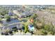 An aerial view showcases the pool and clubhouse amenities with surrounding ponds and trees at 5412 Caramella Dr, Orlando, FL 32829