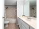 Bathroom with a bathtub and shower, vanity with a sink and a mirror at 5412 Caramella Dr, Orlando, FL 32829