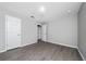 Empty bedroom with hardwood floors and white doors at 5412 Caramella Dr, Orlando, FL 32829