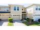 Attractive two-story townhome featuring a one car garage and well-maintained landscaping at 5412 Caramella Dr, Orlando, FL 32829