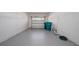 Clean garage featuring painted floors, providing a versatile and organized space for storage at 5412 Caramella Dr, Orlando, FL 32829