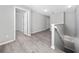 Hallway with wood-look floors, creating a cohesive and stylish transition between rooms at 5412 Caramella Dr, Orlando, FL 32829