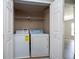 Functional laundry closet with washer and dryer included, adding convenience to your daily routine at 5412 Caramella Dr, Orlando, FL 32829