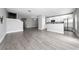 Spacious open-concept living space with hardwood floors and a modern kitchen at 5412 Caramella Dr, Orlando, FL 32829