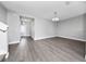 Bright living room with laminate flooring and open entry to front door at 5412 Caramella Dr, Orlando, FL 32829
