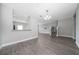 Open-concept living area with laminate flooring and stairs to second floor at 5412 Caramella Dr, Orlando, FL 32829