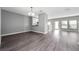 Spacious living room with modern laminate flooring and lots of natural light at 5412 Caramella Dr, Orlando, FL 32829