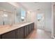 Modern bathroom featuring tile floors, large glass shower and dark gray cabinets at 5719 Cattle Ranch Dr, St Cloud, FL 34771