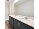 Bathroom with large vanity, dual sinks, white tile, and a walk-in shower and bath combo at 5719 Cattle Ranch Dr, St Cloud, FL 34771