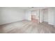 Upstairs room with white trim and walls, neutral carpet and double doors at 5719 Cattle Ranch Dr, St Cloud, FL 34771