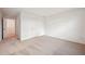 Bright bedroom featuring neutral carpet, white walls and trim, and a closet door at 5719 Cattle Ranch Dr, St Cloud, FL 34771