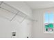 Bright closet features a white wire shelf and a window at 5719 Cattle Ranch Dr, St Cloud, FL 34771