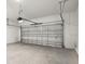 Spacious garage with white walls and gray concrete floor at 5719 Cattle Ranch Dr, St Cloud, FL 34771