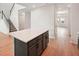 Kitchen island with gray cabinets, stainless steel appliances, and white countertops at 5719 Cattle Ranch Dr, St Cloud, FL 34771