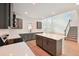 This kitchen features stainless steel appliances, gray cabinets, and a large island at 5719 Cattle Ranch Dr, St Cloud, FL 34771