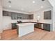 Bright, open kitchen featuring an island, stainless steel appliances, and plenty of counter space at 5719 Cattle Ranch Dr, St Cloud, FL 34771