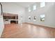 Spacious living room with tall ceilings, bright windows, and kitchen with stainless appliances at 5719 Cattle Ranch Dr, St Cloud, FL 34771