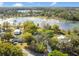 Aerial view of the property with lake views and mature trees at 5850 Sheryl Anita St, Oviedo, FL 32765