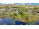Aerial view of lakeside property with a lush, green landscape at 5850 Sheryl Anita St, Oviedo, FL 32765