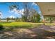 Expansive backyard featuring lush green grass and a brick paver patio overlooking the landscape at 5850 Sheryl Anita St, Oviedo, FL 32765
