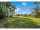 Spacious, well-maintained lawn leading to a tranquil lake at 5850 Sheryl Anita St, Oviedo, FL 32765