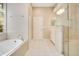 Bathroom showcasing a soaking tub and glass enclosed shower at 5850 Sheryl Anita St, Oviedo, FL 32765
