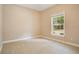 Neutral bedroom with a window and carpet at 5850 Sheryl Anita St, Oviedo, FL 32765