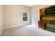Neutral bedroom with a window, carpet and a desk with attached hutch at 5850 Sheryl Anita St, Oviedo, FL 32765