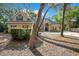 Charming single-Gathering home featuring a manicured lawn, mature trees, and a welcoming facade at 5850 Sheryl Anita St, Oviedo, FL 32765