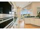 Well-equipped kitchen featuring stainless steel appliances and a cozy window seat at 5850 Sheryl Anita St, Oviedo, FL 32765