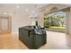 Bright living room with a wall of windows offering views of the backyard at 5850 Sheryl Anita St, Oviedo, FL 32765