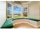 Inviting window seat with scenic views of the lush outdoor landscape at 5850 Sheryl Anita St, Oviedo, FL 32765