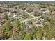 Drone shot of the neighborhood highlighting the proximity to houses, streets, and natural landscapes at 6551 Hemlock Rd, Ocala, FL 34472
