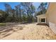 Spacious backyard with partial tree coverage and covered porch at 6551 Hemlock Rd, Ocala, FL 34472