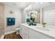 Modern bathroom featuring double sinks, white cabinets, gold hardware, and stylish decor at 6551 Hemlock Rd, Ocala, FL 34472