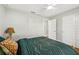 Cozy bedroom features a ceiling fan, a closet and neutral paint at 6551 Hemlock Rd, Ocala, FL 34472