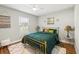 Bright bedroom with plush rug, modern decor, and comfortable furnishings at 6551 Hemlock Rd, Ocala, FL 34472