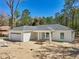 New construction with a welcoming front porch and attached two-car garage at 6551 Hemlock Rd, Ocala, FL 34472