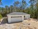 New construction with a welcoming front porch and attached two-car garage at 6551 Hemlock Rd, Ocala, FL 34472