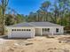 New construction with a welcoming front porch and attached two-car garage at 6551 Hemlock Rd, Ocala, FL 34472