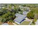 An aerial view of a single-story home with a well-maintained roof and surrounding green foliage at 714 Kankakee Ln, Orlando, FL 32807