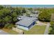 A single-story home captured from above, showcasing its backyard, clean roof and surrounding greenery at 714 Kankakee Ln, Orlando, FL 32807