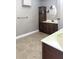 Bathroom showcasing a vanity with a sink, mirror, and tiled floor at 714 Kankakee Ln, Orlando, FL 32807