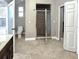 Bathroom featuring a glass-enclosed shower, toilet, and tiled floors at 714 Kankakee Ln, Orlando, FL 32807