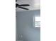 Bedroom view with light blue walls, a ceiling fan, and a window for natural light at 714 Kankakee Ln, Orlando, FL 32807