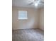 Cozy bedroom featuring a ceiling fan, carpeted floors, and a bright window at 714 Kankakee Ln, Orlando, FL 32807