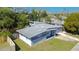 A view of a well-maintained single-story home from its side, highlighting its charming exterior and green yard at 714 Kankakee Ln, Orlando, FL 32807