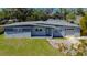 Charming single-story home with a well-kept lawn, attached garage, and freshly painted exterior at 714 Kankakee Ln, Orlando, FL 32807